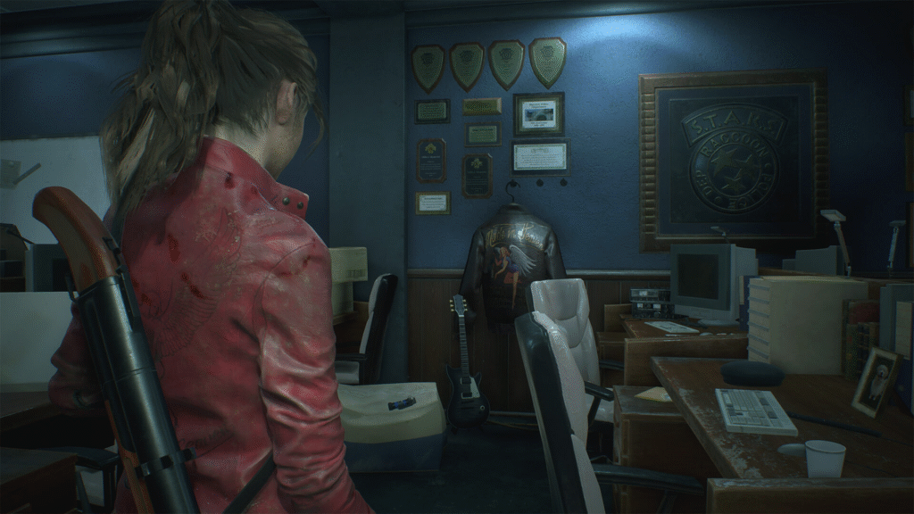 Rookie cop Leon S. Kennedy exploring the RPD Hall in the Resident Evil 2 Remake.